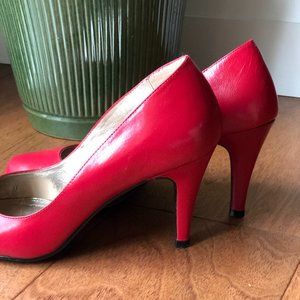 Red leather pumps